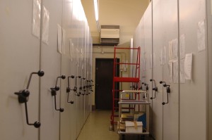 Aisle in archive strongroom with rolling racks